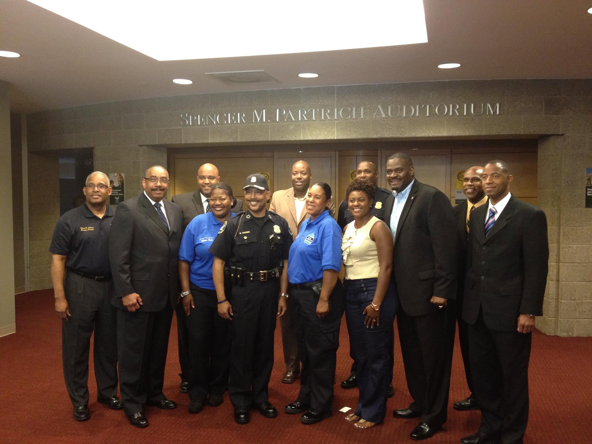 Community leaders and partners gathered at an auditorium